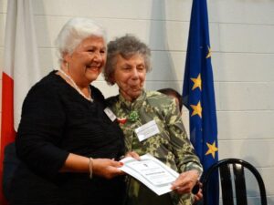 MCCV Welfare Director Mrs Rosemary Attard (left) presents the award to Mrs Carmen Testa